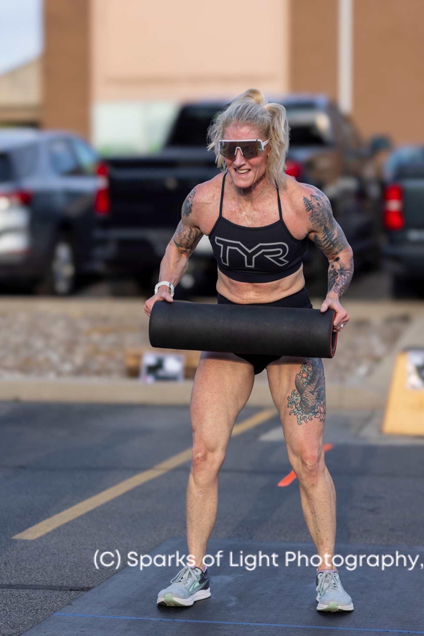 An athlete carrying a dead ball during a DEKA competition zone at Ruckhouse Athletics
