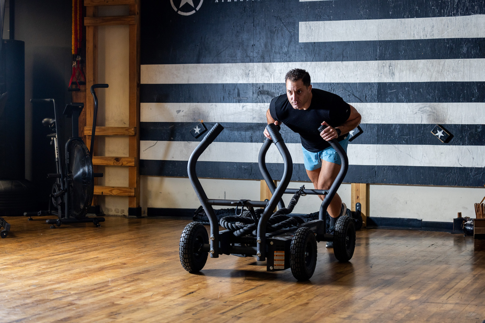 Athlete training with a sled