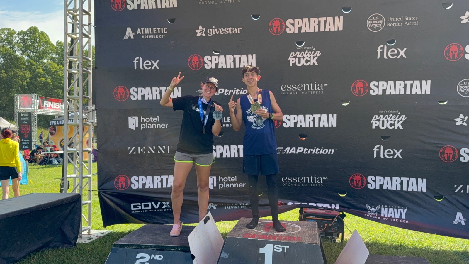 Ruckhouse Athletics athletes with medals on the 1st and 2nd place podium at the Spartan West Virginia race